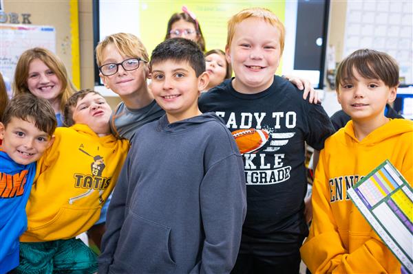 Students inside their classrooms learning. 